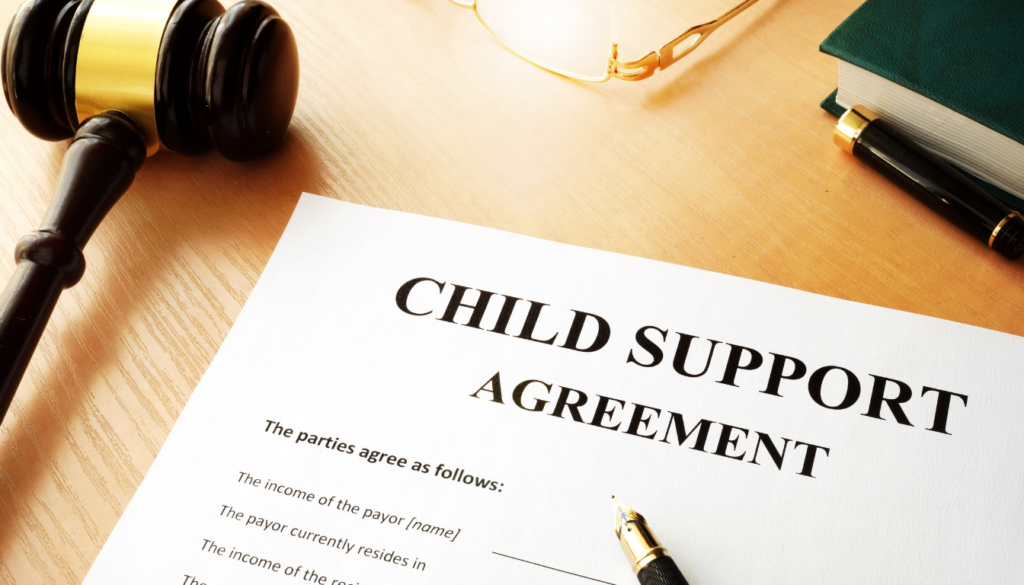 Child support agreement document on a desk with judge’s gavel and pen, representing Maryland child support guidelines and calculator